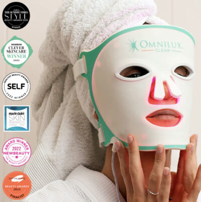 Woman wearing her OMNILUX CLEAR medical grade mask after shower, turban on her hair.