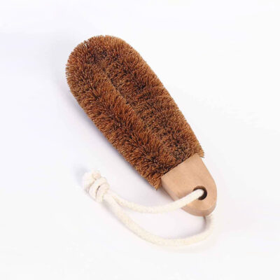 Foot brush made of Coconut Fibre, which is naturally antibacterial, and has a wooden handle with a loop of rope that you can easily slip your hand into for easily removing dead skin and calloused heels.